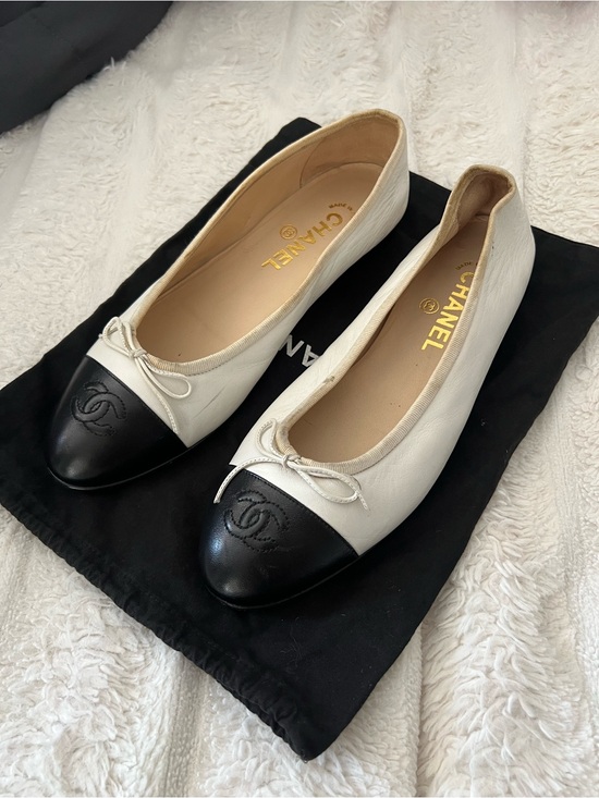 CHANEL Shoes - CHANEL White Leather Ballet Flats with Black Cap Toe